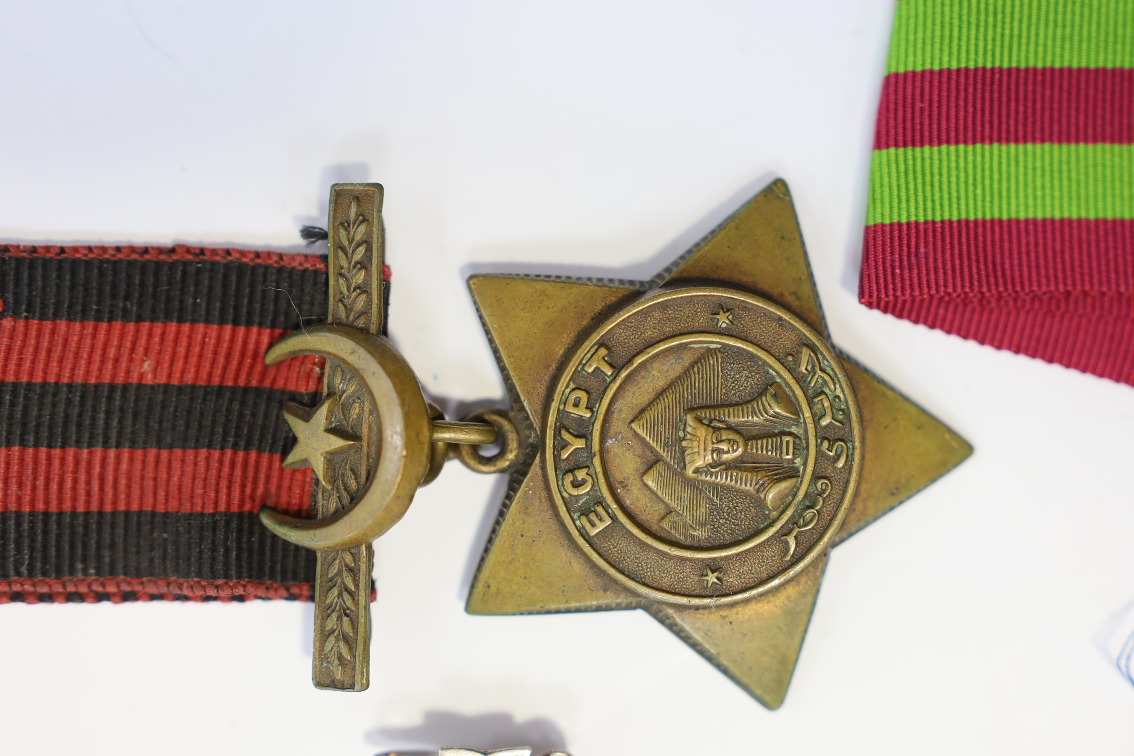 Replica medals; Khedive's Star 1884-6 and another undated; Ashanti star; Spink British North Borneo medal, a loose North West Frontier 1930-31 clasp and a Total Abstinence India medal 50-80